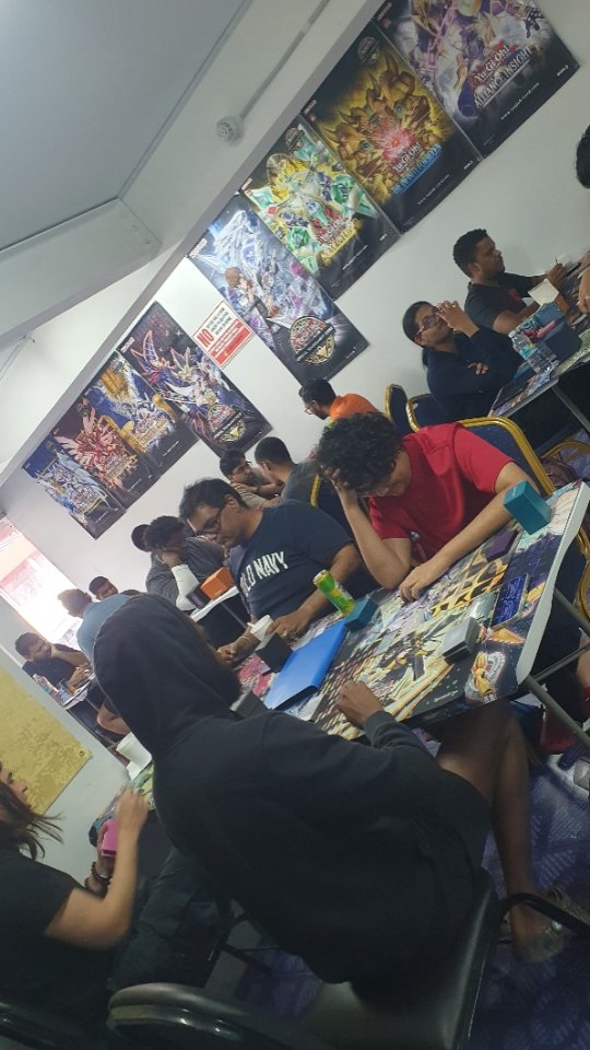 Players gathered around a tabletop game